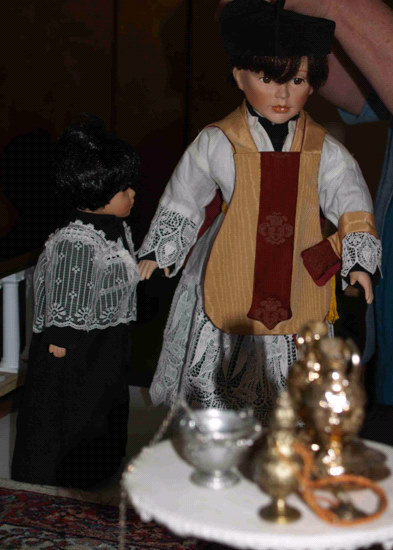 Father George training doll